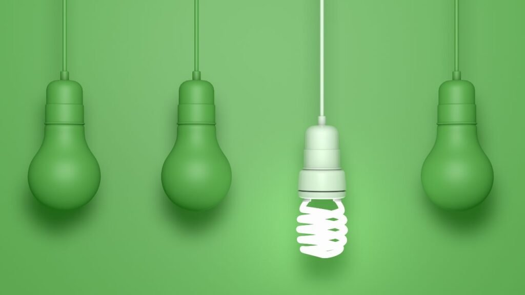 A busy office environment with bright energy-efficient lighting, showcasing professional electricians at work inspecting electrical systems