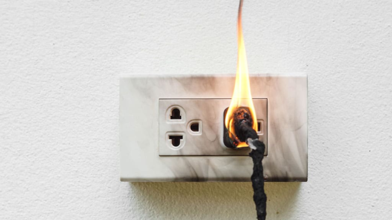 Electrical Outlet Fire Signaling an Electrical Emergency